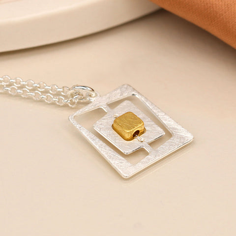 Pom Brushed Silver Plated Offset Square Pendant Necklace with Gold Centre