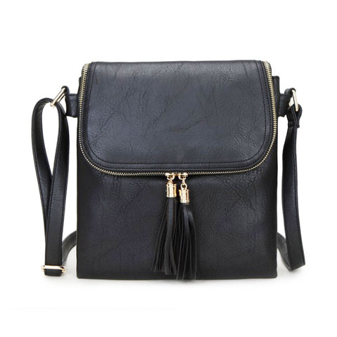 Long & Son Black faux-leather crossbody bag with a front flap, gold-tone zipper, and black tassel zipper pulls.
