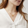Annie Oak Bee Geometric Necklace in Gold modelled Annie Oak Bee Geometric Necklace in Gold modelled