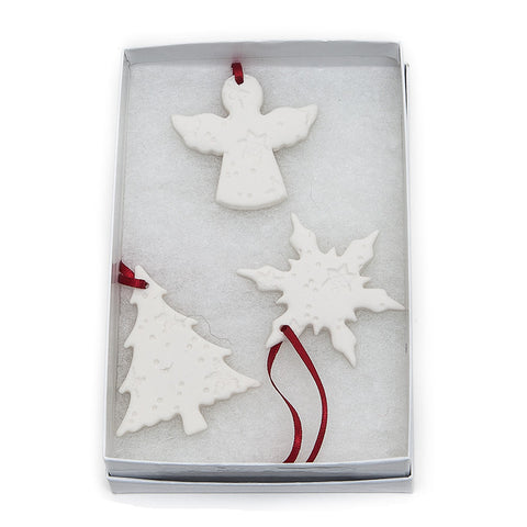 Angel Ceramics set of three embossed hanging Christmas decorations comprising an angel, Christmas tree and snowflake.