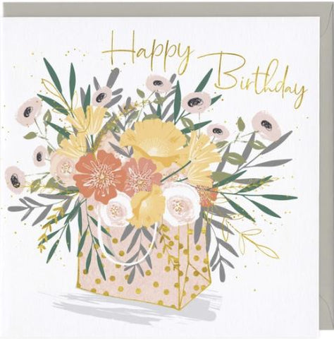 Happy Birthday card featuring a bouquet in a gift bag
