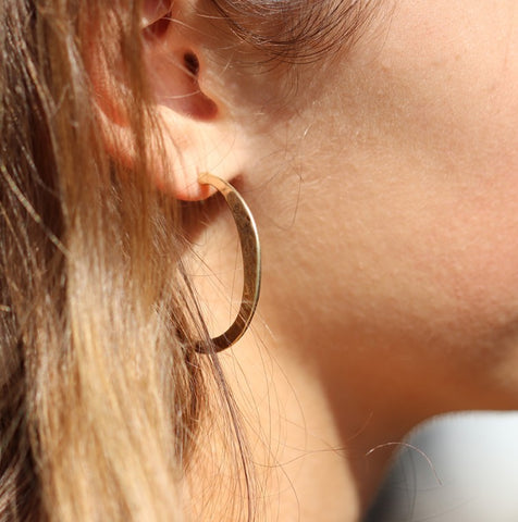 Pom  Worn Gold Irregular Hammered Open Hoop Earrings Earrings Modelled