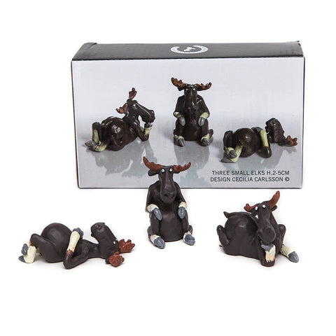 Three Small Elk character figures from Naasgransgarden reposing on front back and sitting